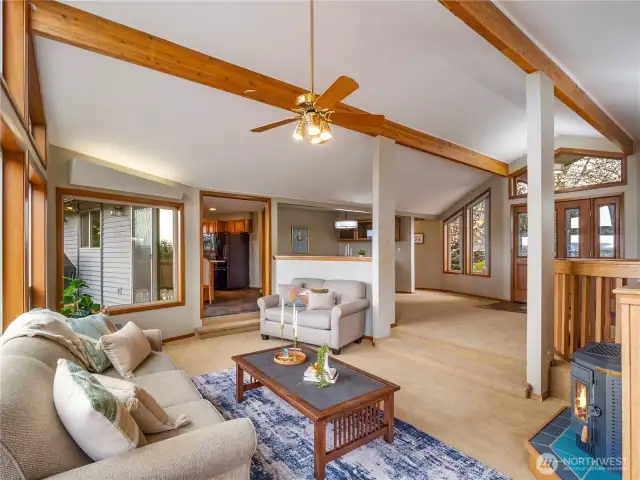 The vaulted ceilings in the living room has warm colored wood beams that gives this space that little extra.