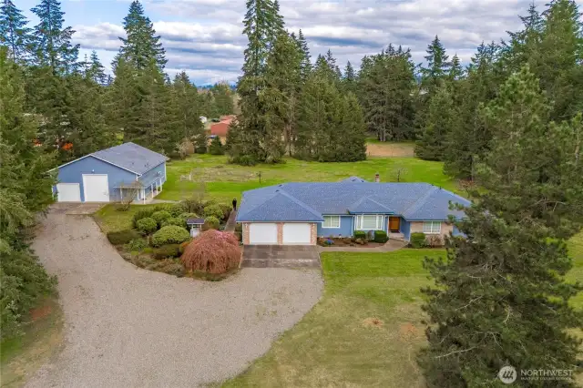 Nearly 5.5 Acres w/ Single Level Home and RV Garage w/ Bath