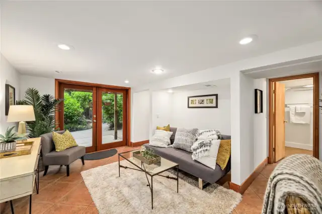 Downstairs Family Room Opening to Stunning Backyard