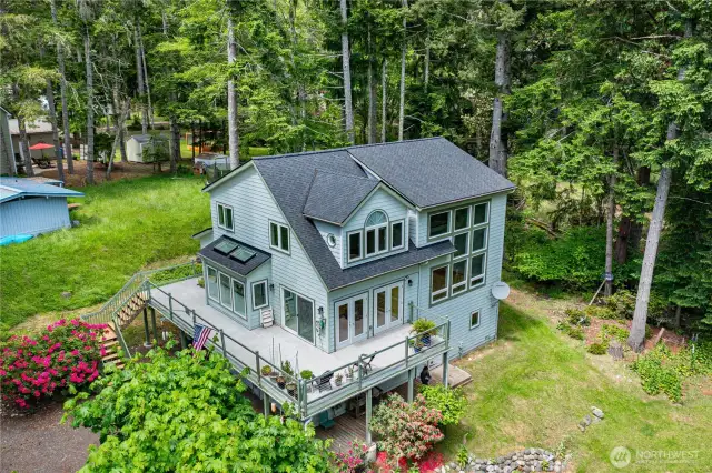 Welcome home to this stunning 3 bed/3 bathroom home spanning three thoughtfully designed levels, offering water views from multiple vantage points.