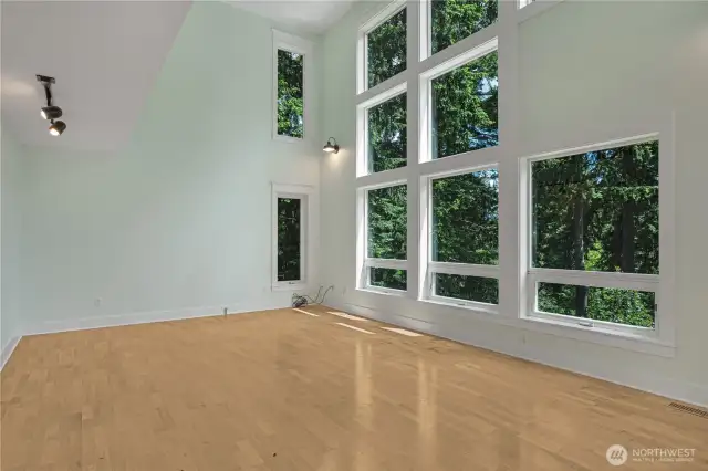 Living room with wall of windows looking east.