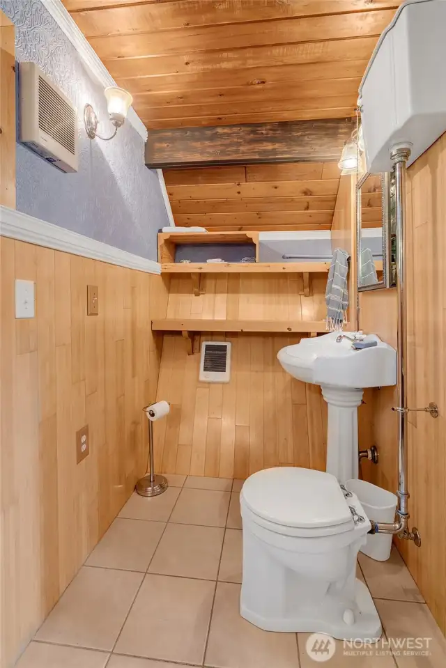 The bath is large and warm and charming