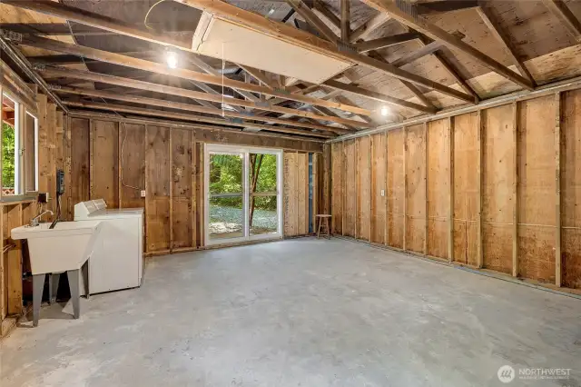 The shop offers a wonderful opportunity for so much. Workshop, game room for pool or shuffleboard or ping pong, as well as laundry and utility space. It could also be a bunkhouse for additional guests.