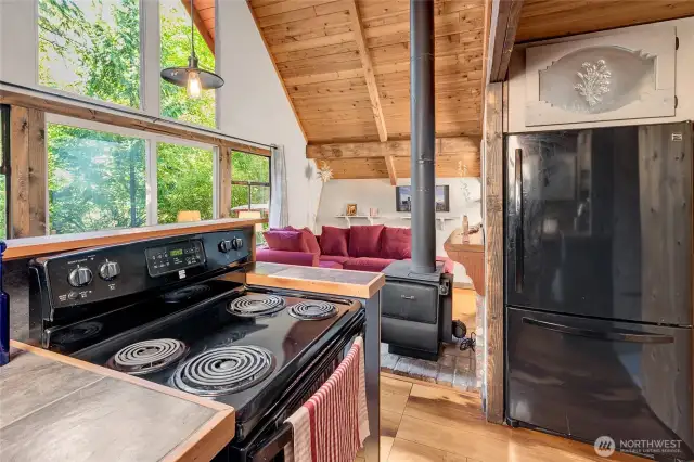 The stove warms the entire cabin for cuddling up in the fall and winter with company and/or a good book.