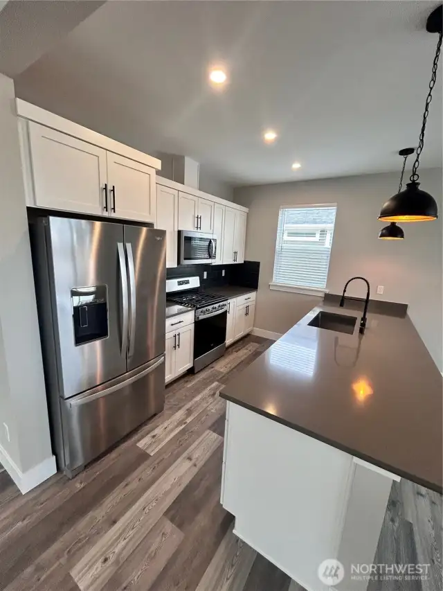 All kitchen appliances included with the purchase. Cabinet color is another buyer selection. *Previous build