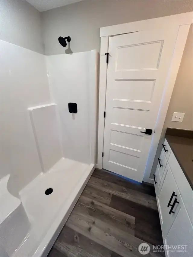 Second primary suite also has a step-in shower. *previous build