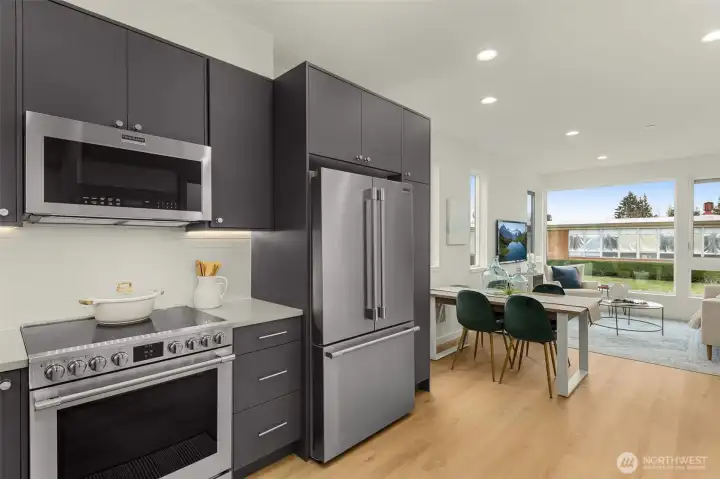 Smartly crafted cabinetry, premium appliances, and abundant counter space make this kitchen a joy to cook in while keeping modern design front and center.