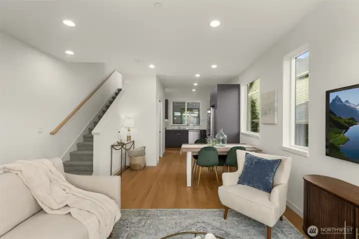 Expansive yet warm, this open living space adapts beautifully to evenings in, holiday gatherings, or cozy movie nights.