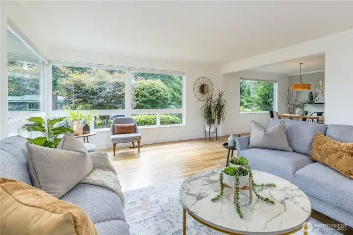 Multiple large windows flood the space with natural light