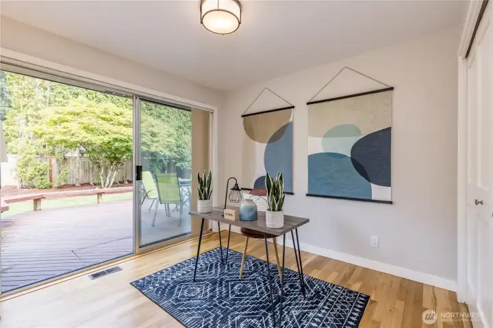 With direct access to the back deck, this fourth bedroom is ideal for a home office, playroom, or cozy guest retreat.