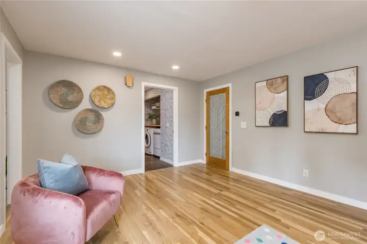 Central family room/flex area. Door on the right leads to all the bedrooms.