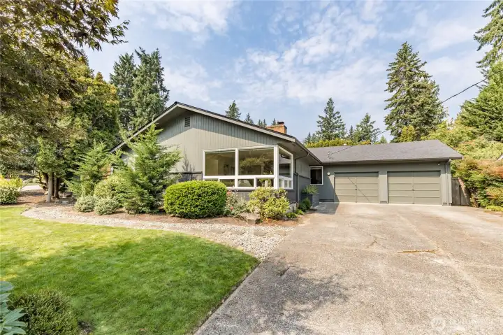 Attached 2-car garage and a long driveway provide ample parking