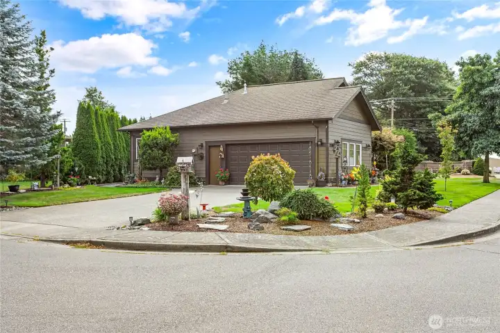 2-car garage, corner lot and beautifully landscaped