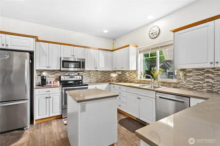 Thoughtfully updated kitchen with stainless appliances.