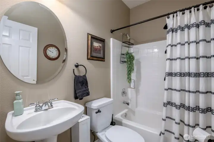 Main hall, full bath immediately off main bed & laundry room.