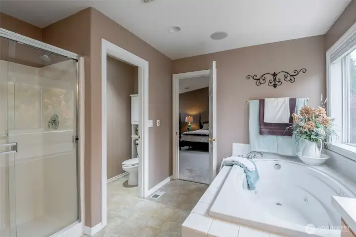 Ensuite affords a full closet plus additional walk-in and a jetted tub.