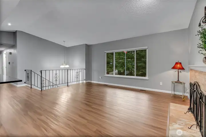 Upstairs living space looking towards hall and downstairs.