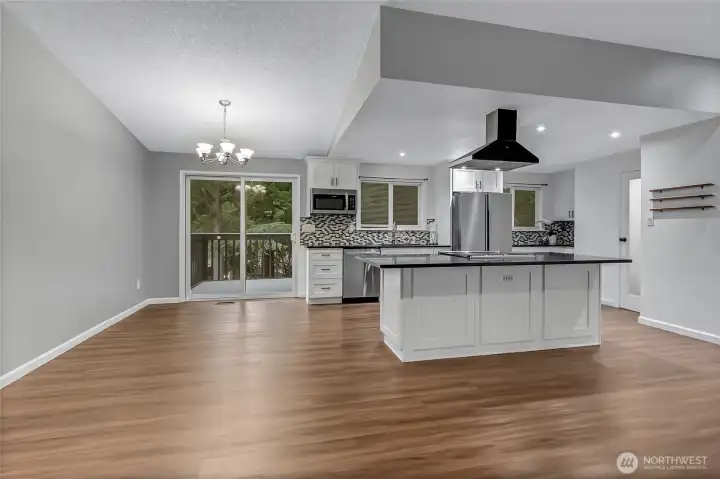 Looking into kitchen and dining space from family room.