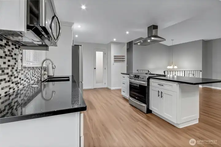 Kitchen with tile backsplash and many upgrades