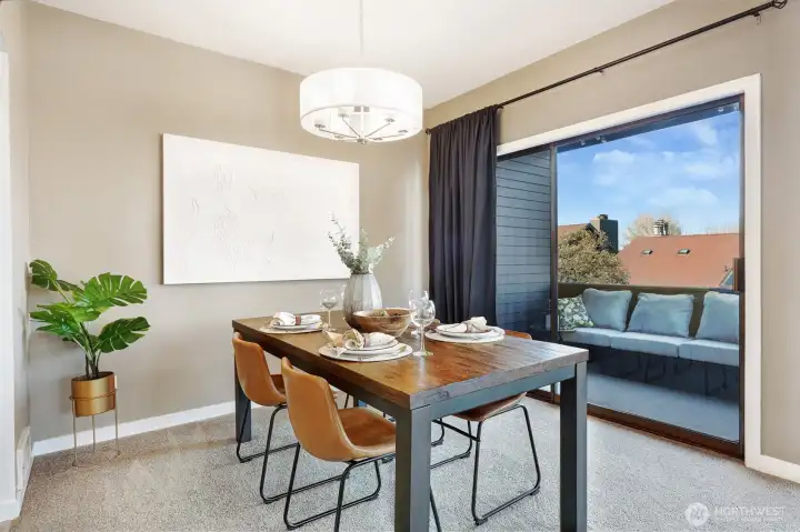Dining room opens to view deck, kitchen and living room