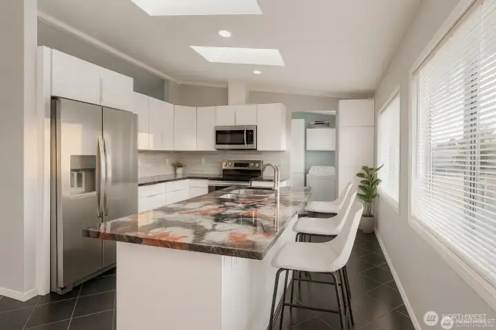 Gorgeous remodeled kitchen with great natural light, island counter and breakfast bar.