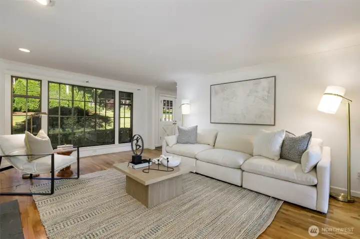 large livingroom with fireplace and slider to back patio