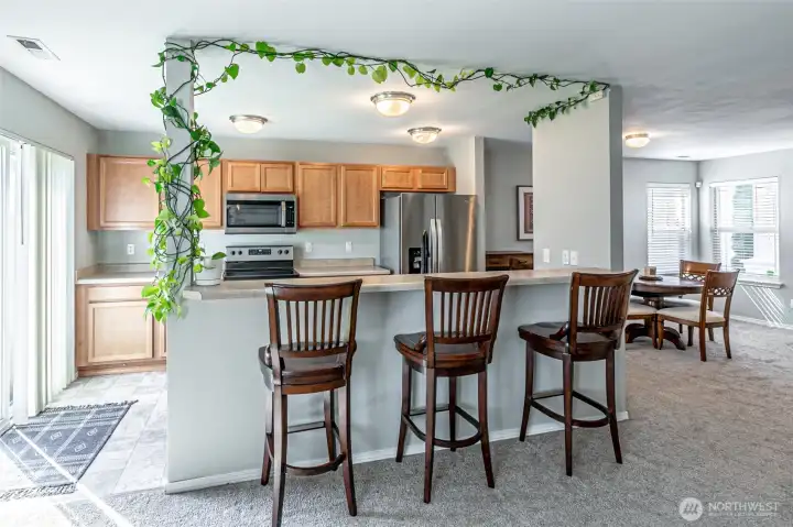 Kitchen with eating bar for casual dining or the buffet on game days.