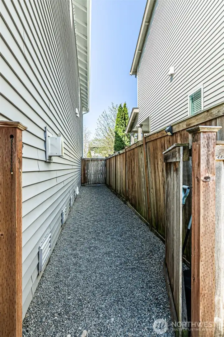 Gravel dog area with gate on one side