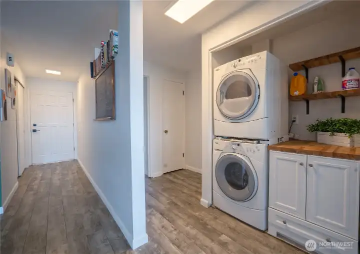 Laundry in hall. Special feature is a pull out drying rack between washer and dryer. Check it out! New storage cabinet installed
