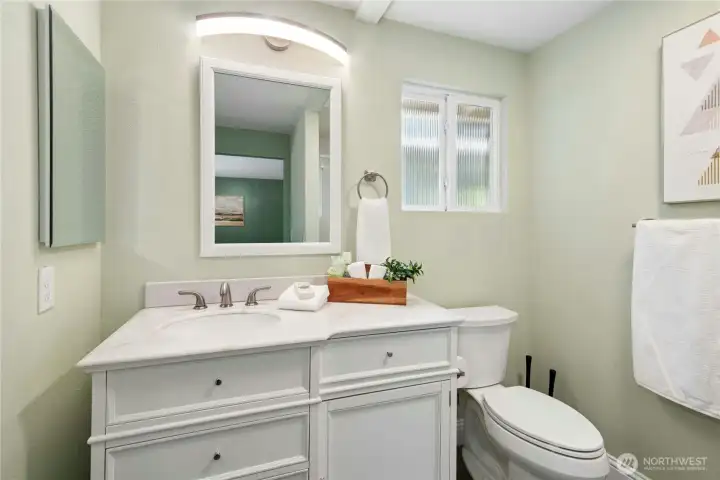 Beautiful primary 3/4 bathroom with walk-in closet, complete with closet system!