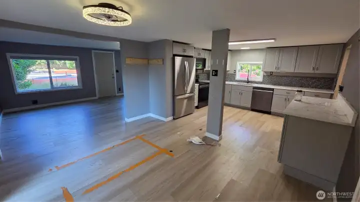 The open-concept floor plan is a standout feature, creating a bright, spacious living area that appeals to both homeowners and renters.