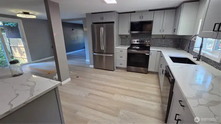 Additional view of the kitchen, showcasing the quality finishes and thoughtful design.