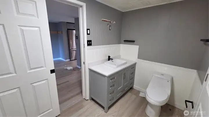 Full renovation underway in the main bathroom, creating a refreshed space with new finishes and improvements.