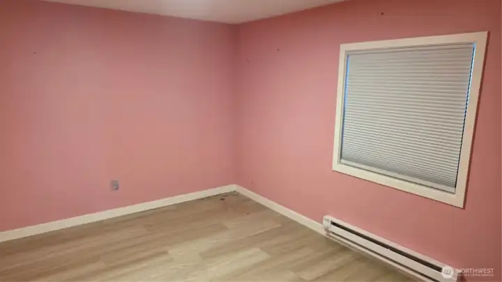 Bedroom #2 is refreshed with brand-new LVP flooring for a stylish and low-maintenance finish.