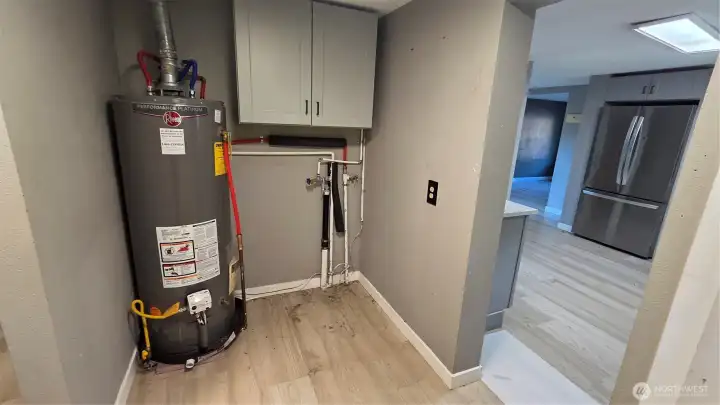 Convenient utility room located just off the kitchen.