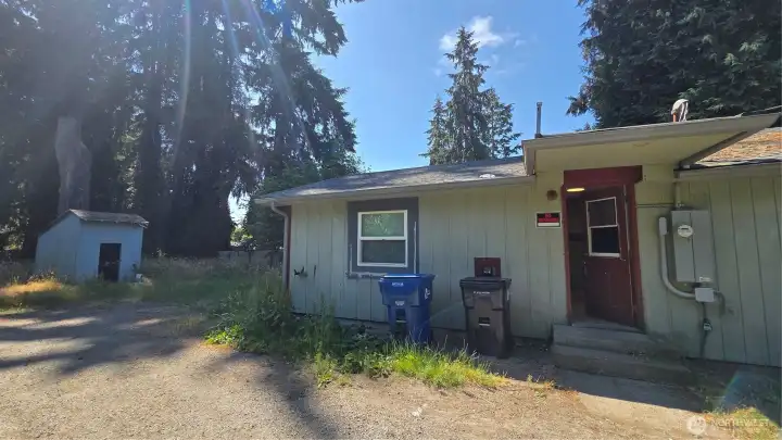 Side elevation of the home with convenient access to the outbuilding on the left.