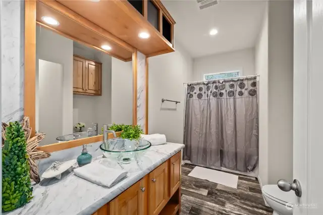 Bathroom bright and tall ceilings.