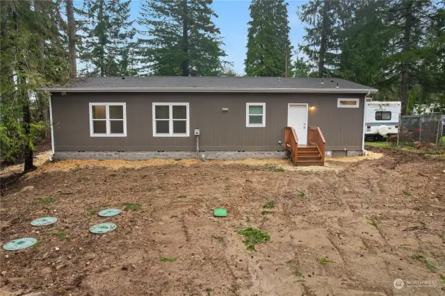 Back deck leads you through the utility room into the kitchen.