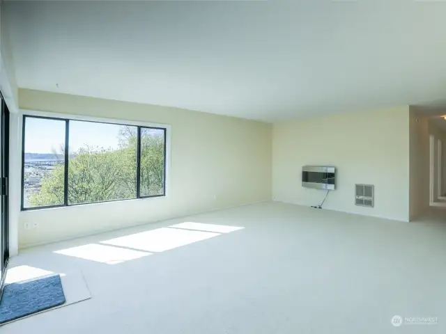 Exceptional views, fireplace, and amazing light in this huge living room.