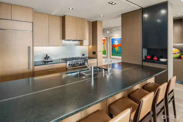 Another view of the Kitchen with large granite Eating Bar.