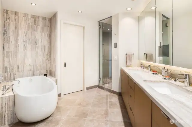 Lavish Primary Bathroom is blissful! Let's start with steam shower, relaxing soaking tub and continue with double sinks, Toto Bidet, heated Floors, and to top it off - a built-in television in the mirror.