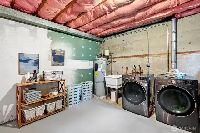 Spacious laundry/storage room.