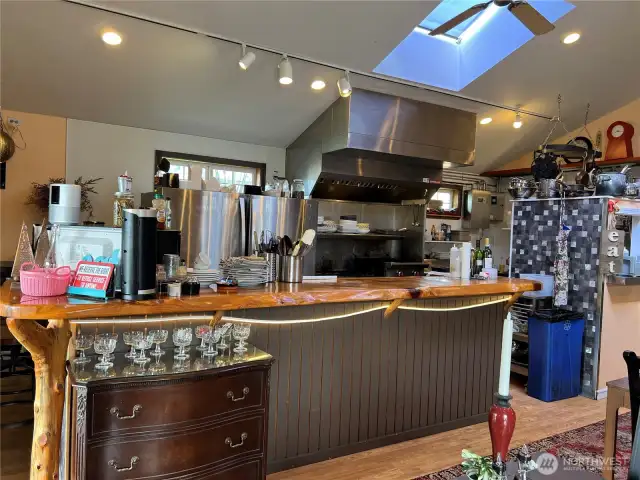 The custom live edge bar and wood accents add to the restaurant experience.
