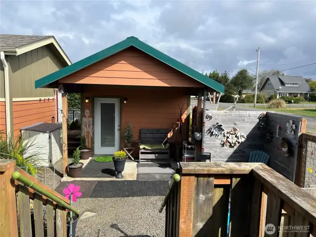 Additional outbuilding for food storage or an office.