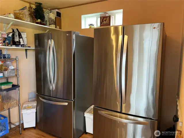 Two more refrigerators and lots of shelving.