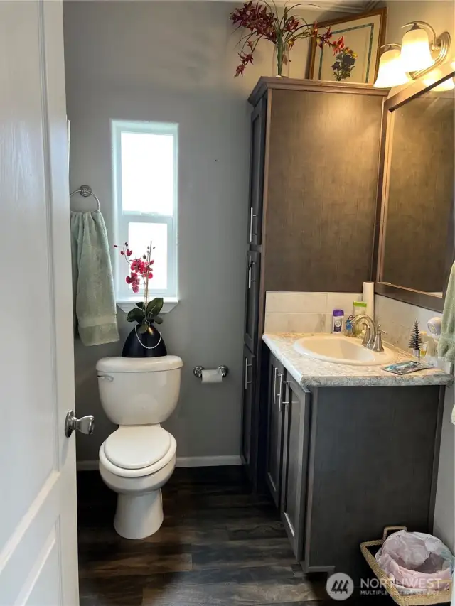 Primary bath.  Laundry is in the hall at the end of the home, conveniently next to the Primary Suite.