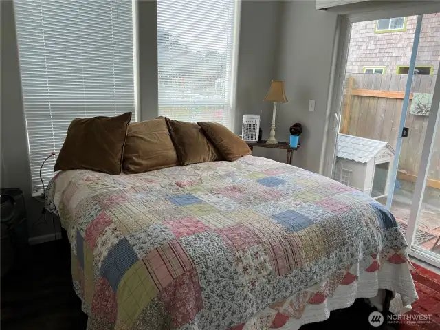 Primary bedroom has a private deck and hot tub just through the sliding doors.