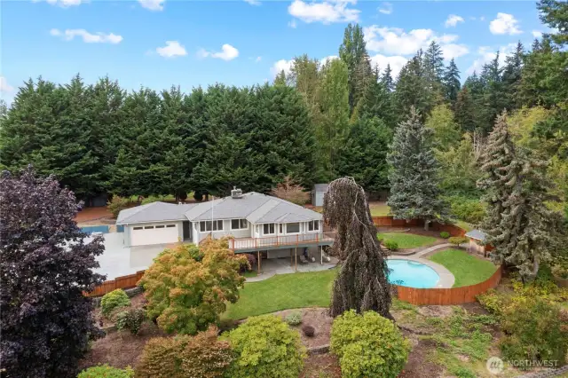 If privacy and room to roam is what you're looking for, you've found your new home! Nestled on a privately situated, shy acre lot lot in a prime Puyallup locale, this is a dream property for outdoor fun