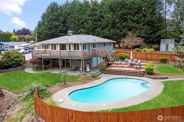 Enjoy the dog days of summer in your in ground pool with patio surround and lots of deck area for outdoor dining & relaxation