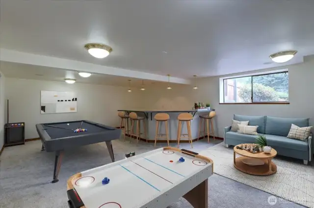 Host an indoor pool party, game night or watch the big game in the enormous bonus room. The custom epoxy bar is plumbed for water so you can create a bar or added kitchen space for generational living. *Room is virtually staged